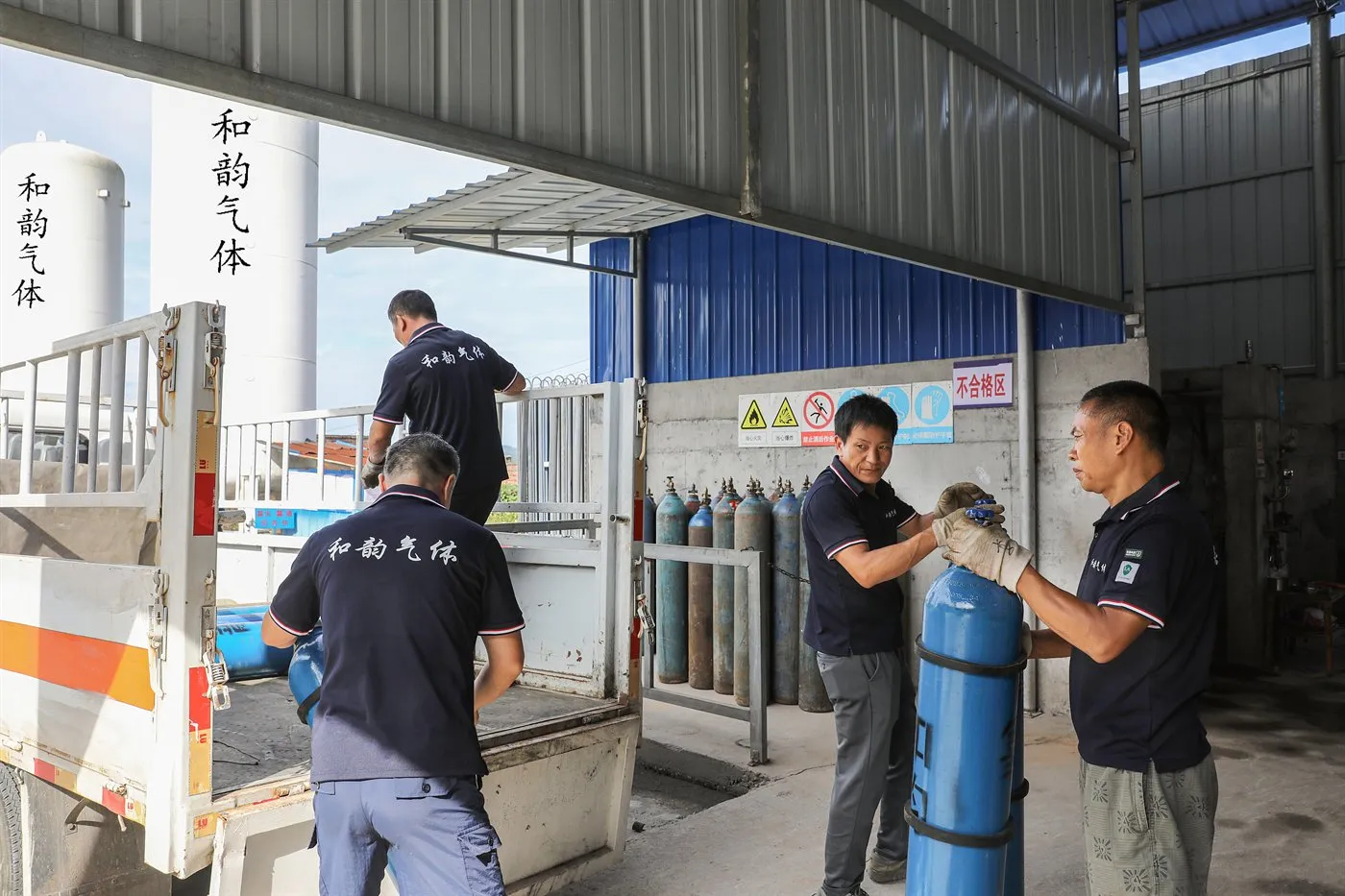 Cylinders being loaded onto a licensed dangerous-goods vehicle